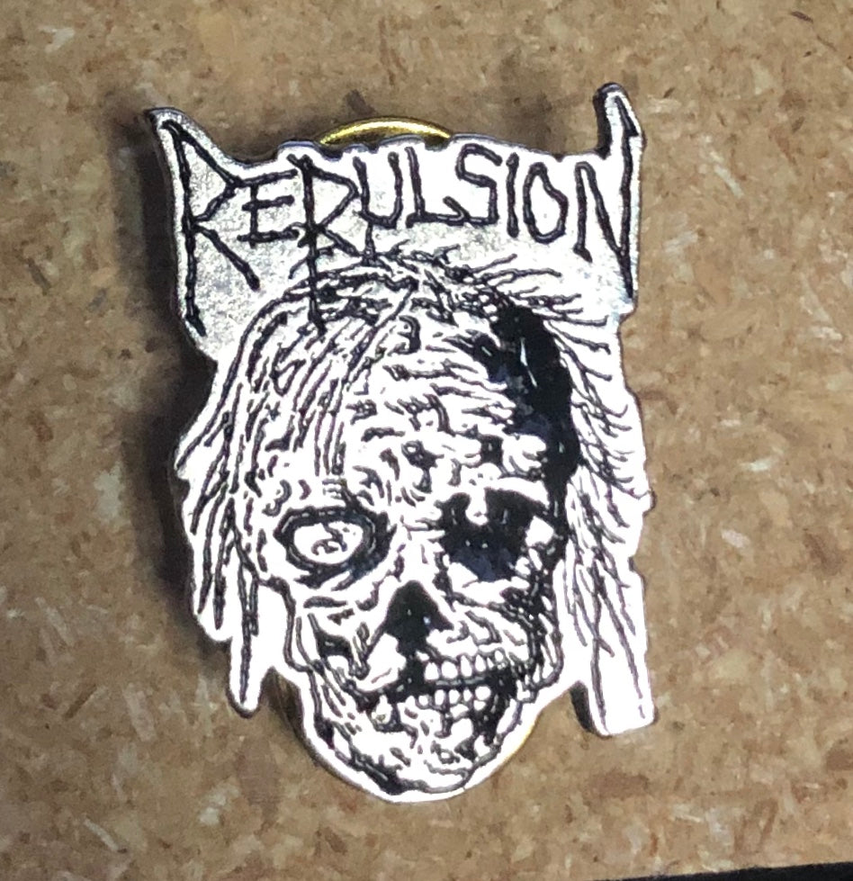 REPULSION - SKULL METAL BADGE